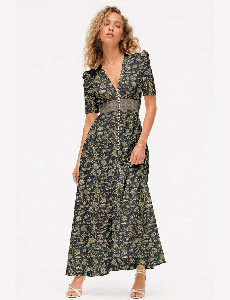 Women’s long sleeve playsuit with wrap-style front, V neckline, notched collar, adjustable waist tie and mid-thigh shorts.