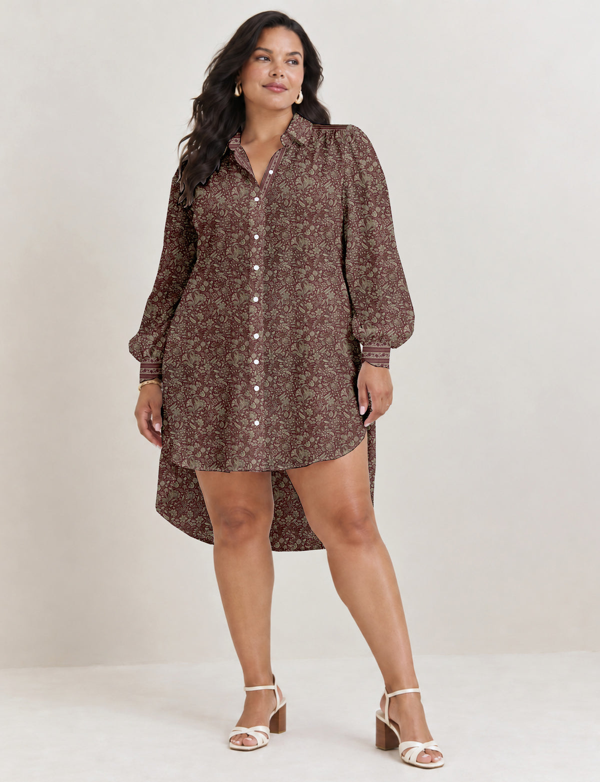 High low shirt with a relaxed fit, button-down front, classic collar, gathered shoulders and full-length blouson sleeves.
