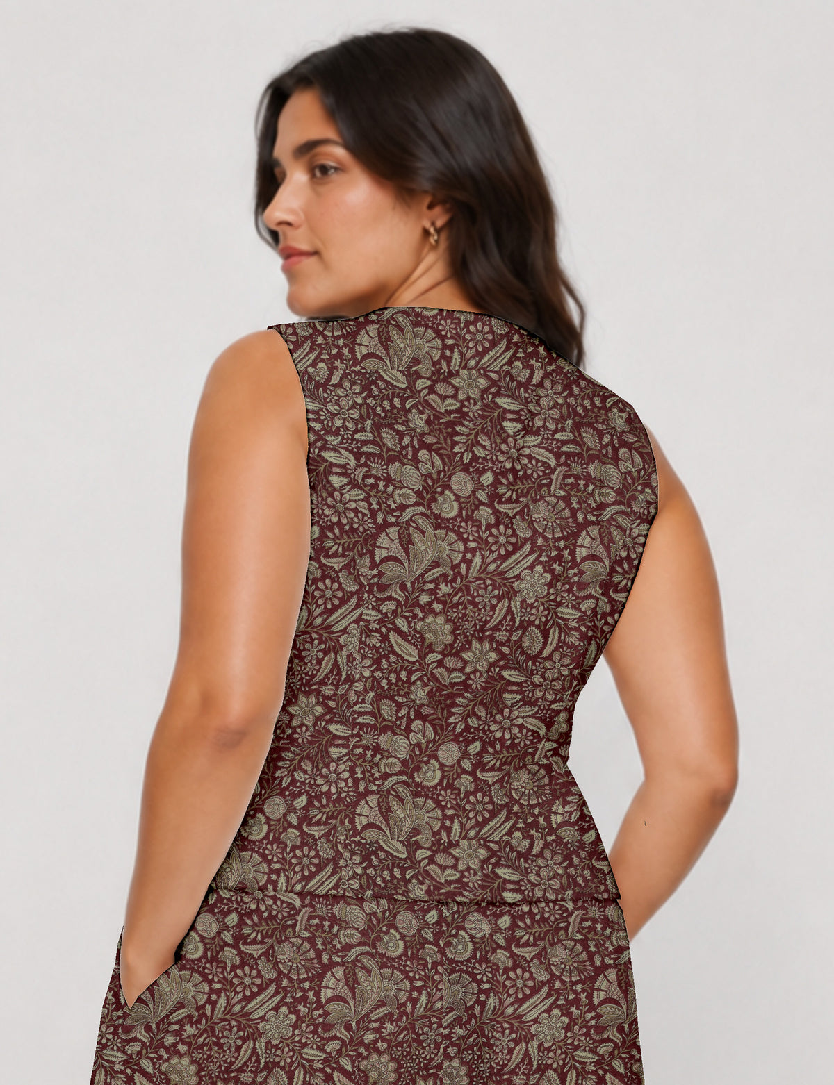 Women's fitted waistcoat with V-neck, single-breasted button closure, tailored silhouette, and pointed hem in sustainable fashion.