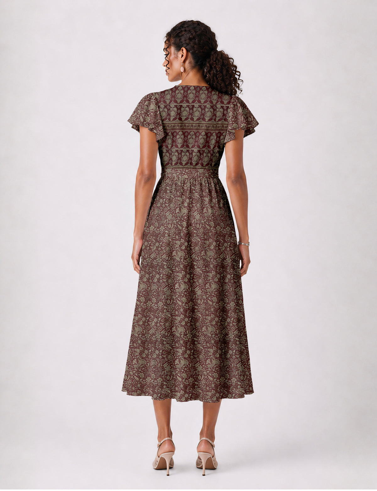 Elegant midi wrap dress with a V-neckline, adjustable waist tie, fitted bodice, and flared skirt for a timeless, flattering silhouette.