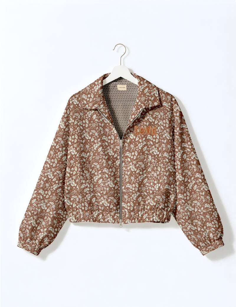 Brown floral bomber jacket with front zipper, elastic cuffs, collar, and "LOVE" embroidered on chest, shown on white hanger