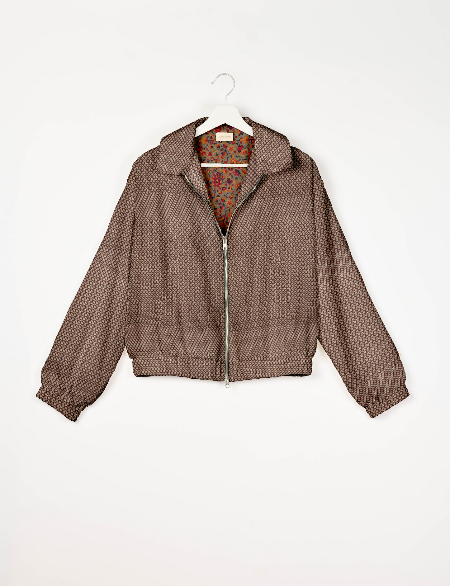 Upcycled Bomber Jacket made from recycled sari materials, featuring a cute cropped shape, elasticated hem and cuffs, and contrast sari print lining. Sustainable apparel promoting eco-friendly fashion and ethical clothing.