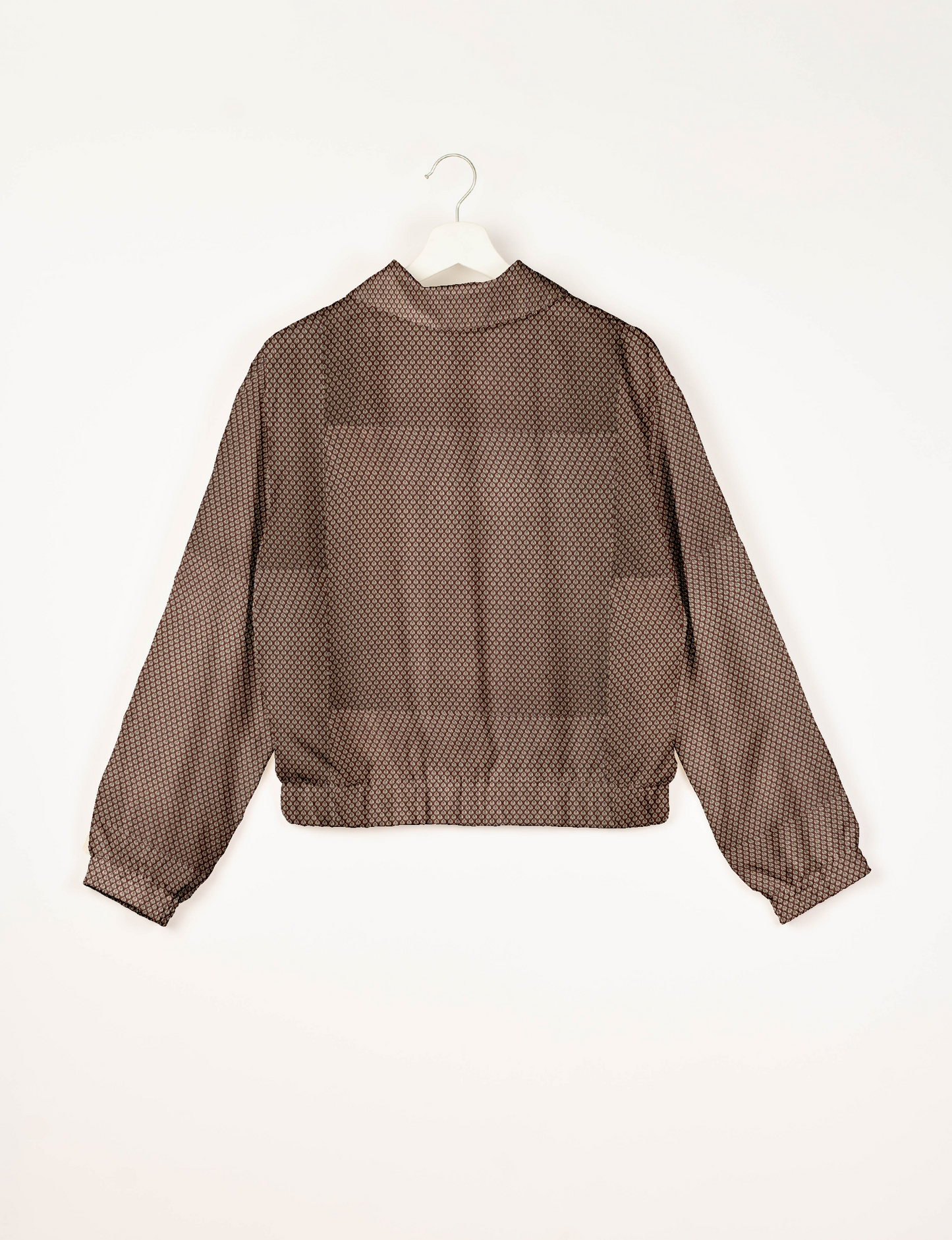 Upcycled Bomber Jacket made from recycled sari materials, featuring a cute cropped shape, elasticated hem and cuffs, and contrast sari print lining. Sustainable apparel promoting eco-friendly fashion and ethical clothing.