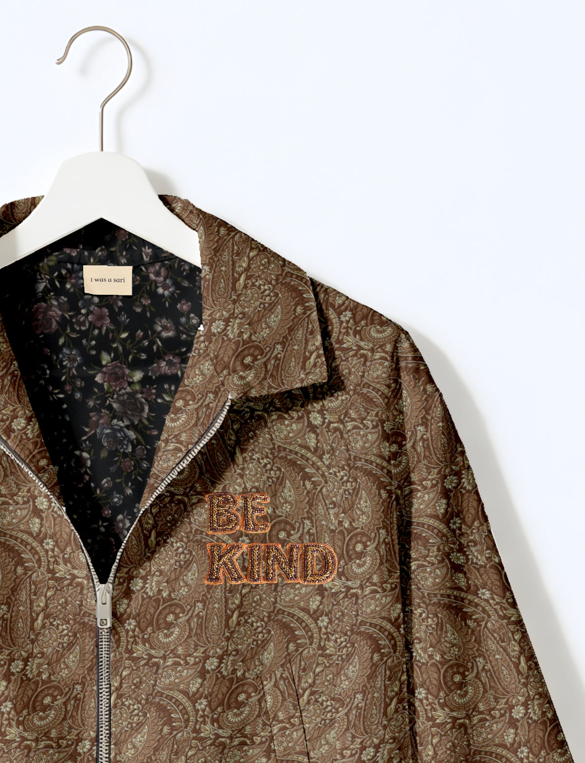 BE KIND Bomber jacket made from upcycled sari fabric with handcrafted Aari embroidery by female artisans.