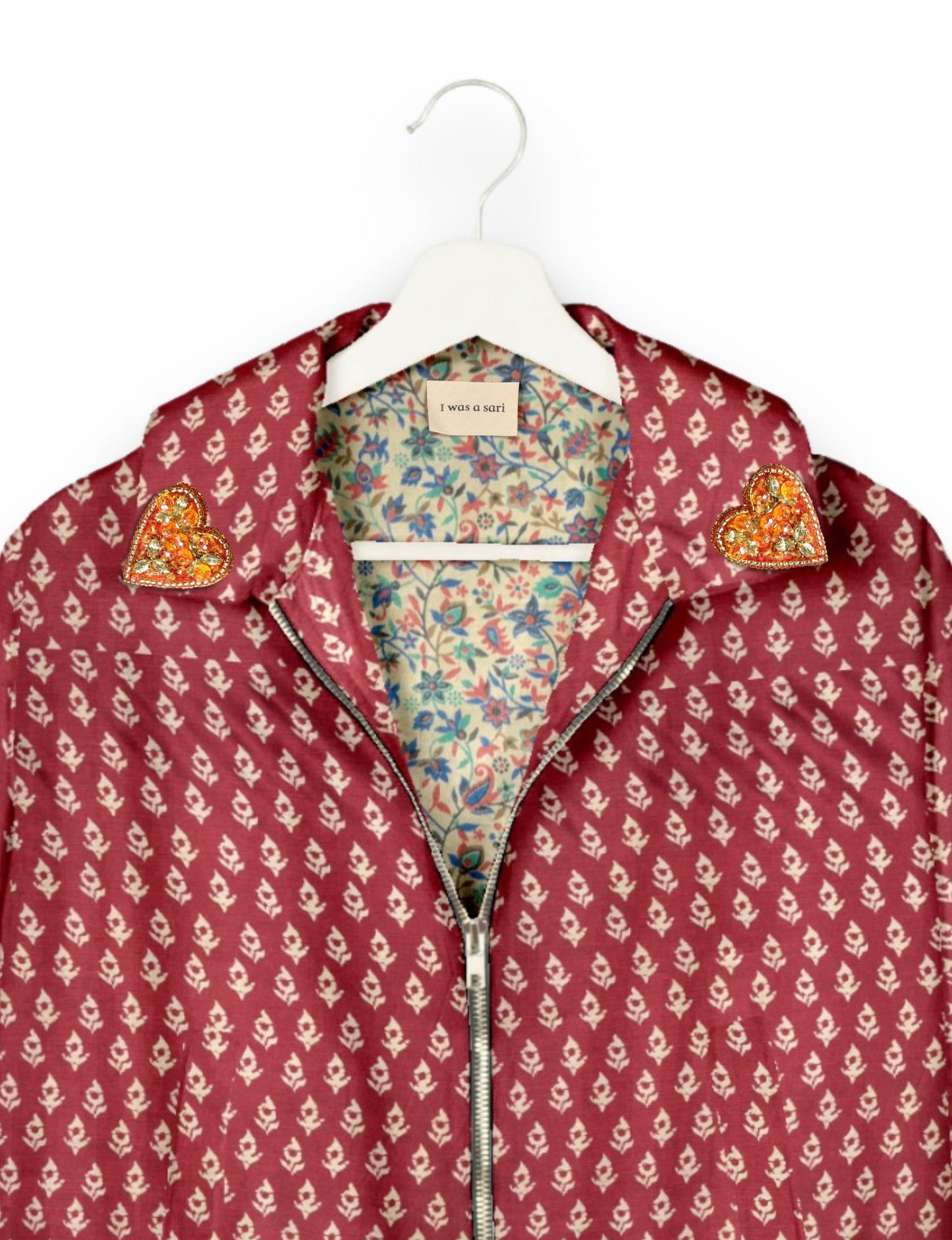 Make a bold statement with our Heart Drop Earrings, a symbol of conscious luxury and ethical fashion. Handcrafted using the intricate Aari embroidery technique, these earrings are made from upcycled sari fabric, embracing slow fashion and zero waste clothing. Elevate your look with sustainable apparel that supports fair trade fashion while reducing textile waste. Choose eco-friendly fashion that speaks of love, artistry, and responsibility.