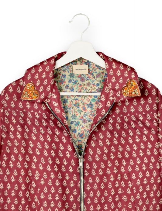 Make a bold statement with our Heart Drop Earrings, a symbol of conscious luxury and ethical fashion. Handcrafted using the intricate Aari embroidery technique, these earrings are made from upcycled sari fabric, embracing slow fashion and zero waste clothing. Elevate your look with sustainable apparel that supports fair trade fashion while reducing textile waste. Choose eco-friendly fashion that speaks of love, artistry, and responsibility.