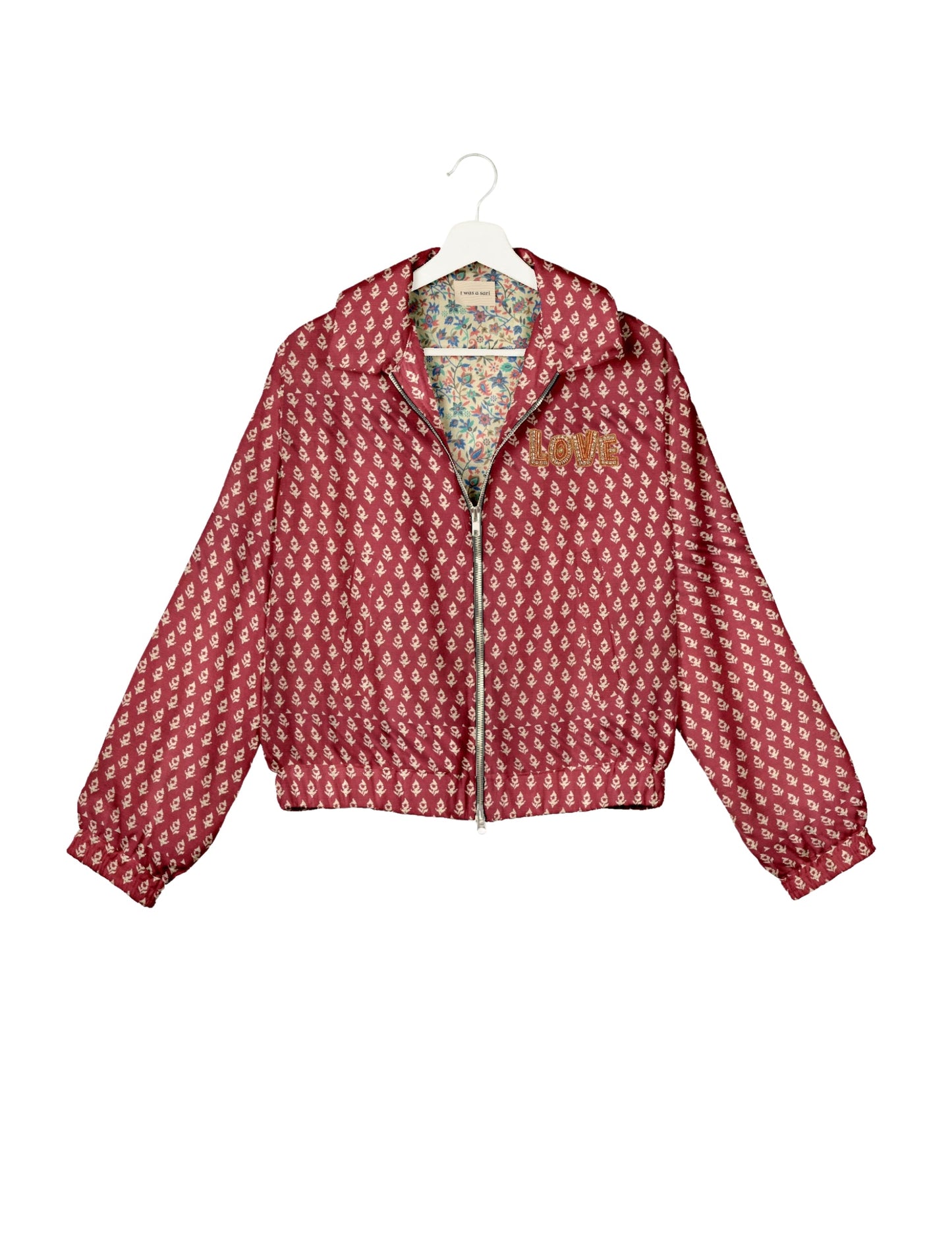 Love Bomber Jacket made from recycled fabric, featuring hand-stitched Aari embroidery. A unique piece of zero-waste clothing, part of the circular fashion movement. Designed with upcycled materials for a stylish yet environmentally friendly clothing choice.