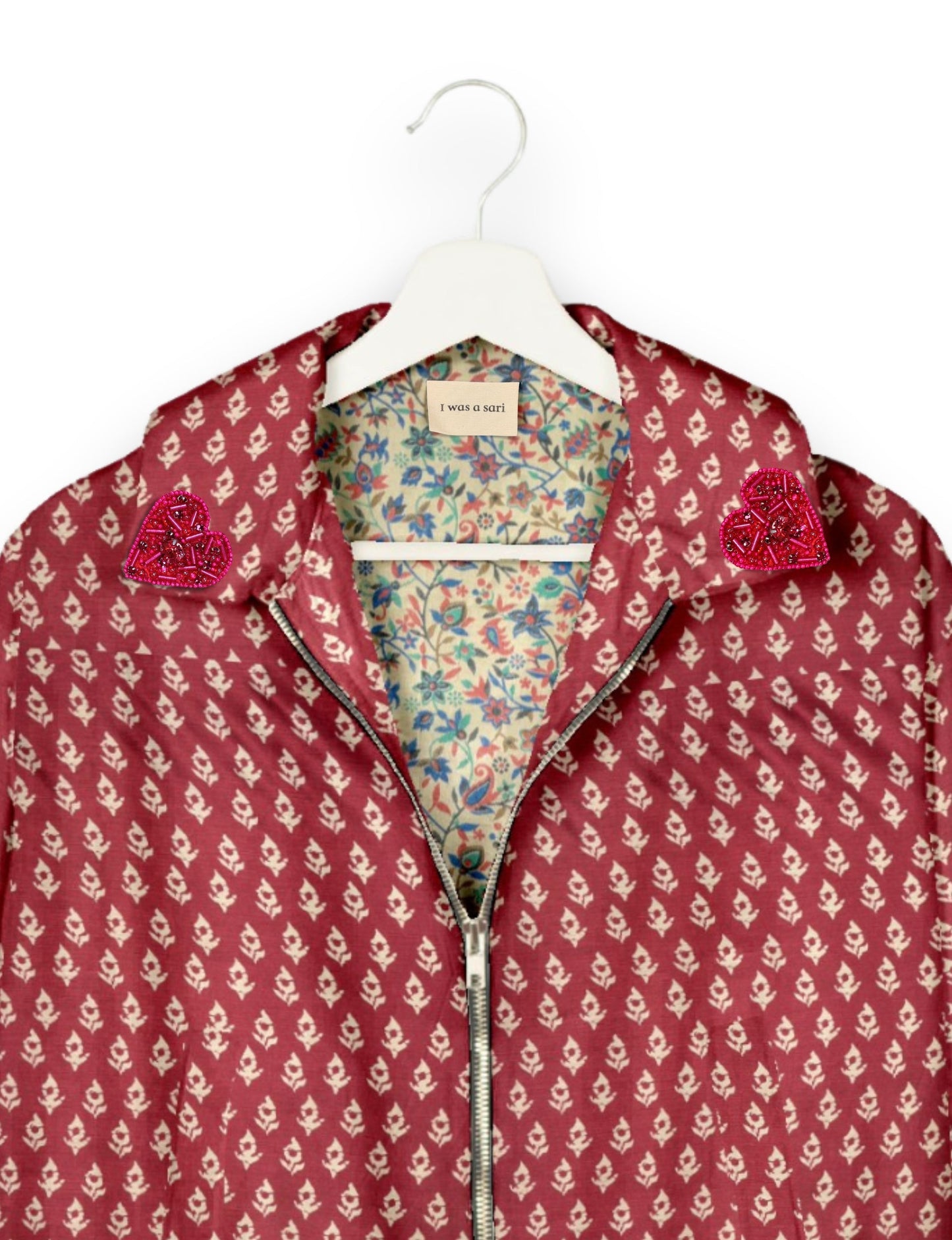 Make a bold statement with our Heart Drop Earrings, a symbol of conscious luxury and ethical fashion. Handcrafted using the intricate Aari embroidery technique, these earrings are made from upcycled sari fabric, embracing slow fashion and zero waste clothing. Elevate your look with sustainable apparel that supports fair trade fashion while reducing textile waste. Choose eco-friendly fashion that speaks of love, artistry, and responsibility.