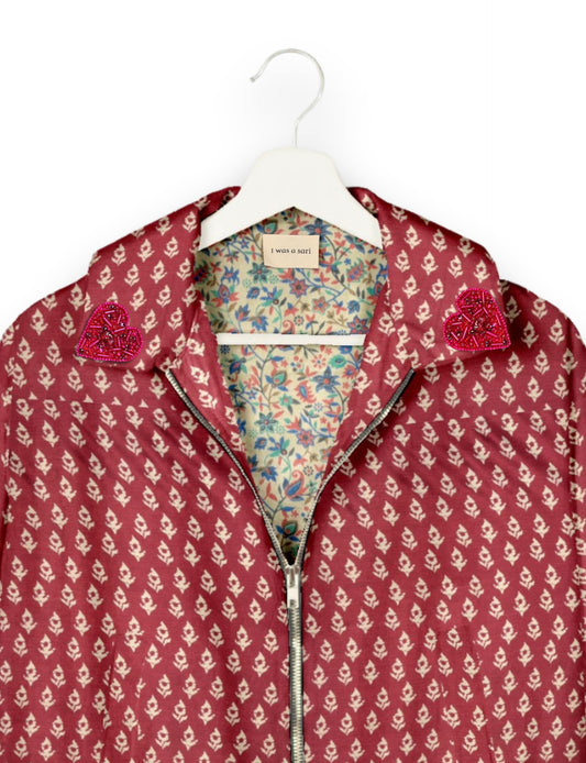 Make a bold statement with our Heart Drop Earrings, a symbol of conscious luxury and ethical fashion. Handcrafted using the intricate Aari embroidery technique, these earrings are made from upcycled sari fabric, embracing slow fashion and zero waste clothing. Elevate your look with sustainable apparel that supports fair trade fashion while reducing textile waste. Choose eco-friendly fashion that speaks of love, artistry, and responsibility.