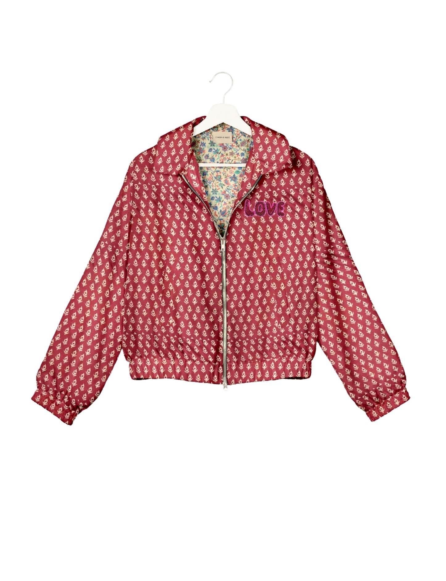 Love Bomber Jacket made from recycled fabric, featuring hand-stitched Aari embroidery. A unique piece of zero-waste clothing, part of the circular fashion movement. Designed with upcycled materials for a stylish yet environmentally friendly clothing choice.