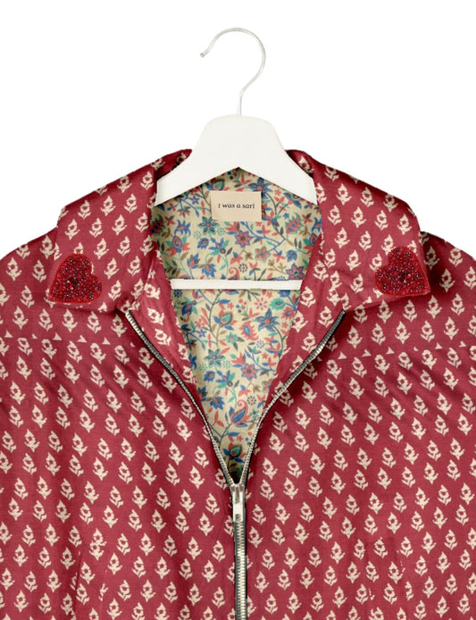 Make a bold statement with our Heart Drop Earrings, a symbol of conscious luxury and ethical fashion. Handcrafted using the intricate Aari embroidery technique, these earrings are made from upcycled sari fabric, embracing slow fashion and zero waste clothing. Elevate your look with sustainable apparel that supports fair trade fashion while reducing textile waste. Choose eco-friendly fashion that speaks of love, artistry, and responsibility.