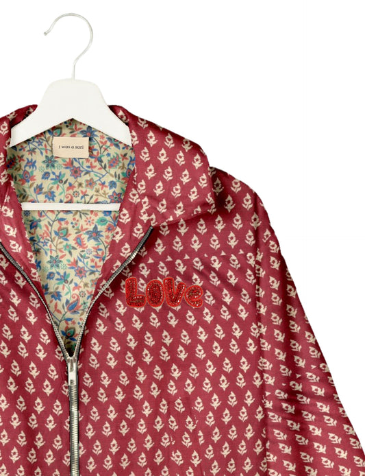 Love Bomber Jacket made from recycled fabric, featuring hand-stitched Aari embroidery. A unique piece of zero-waste clothing, part of the circular fashion movement. Designed with upcycled materials for a stylish yet environmentally friendly clothing choice.
