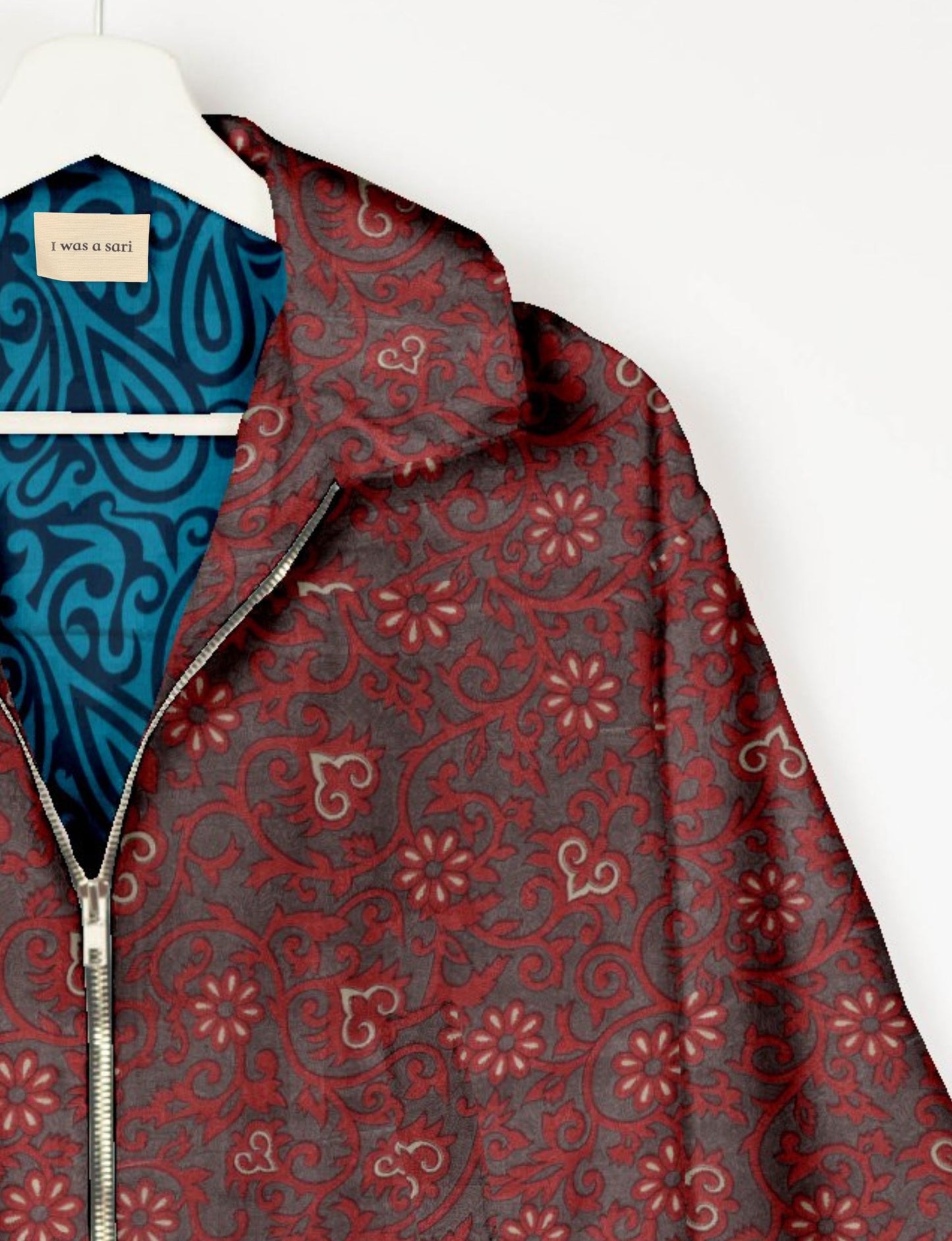 Upcycled Bomber Jacket made from recycled sari materials, featuring a cute cropped shape, elasticated hem and cuffs, and contrast sari print lining. Sustainable apparel promoting eco-friendly fashion and ethical clothing.