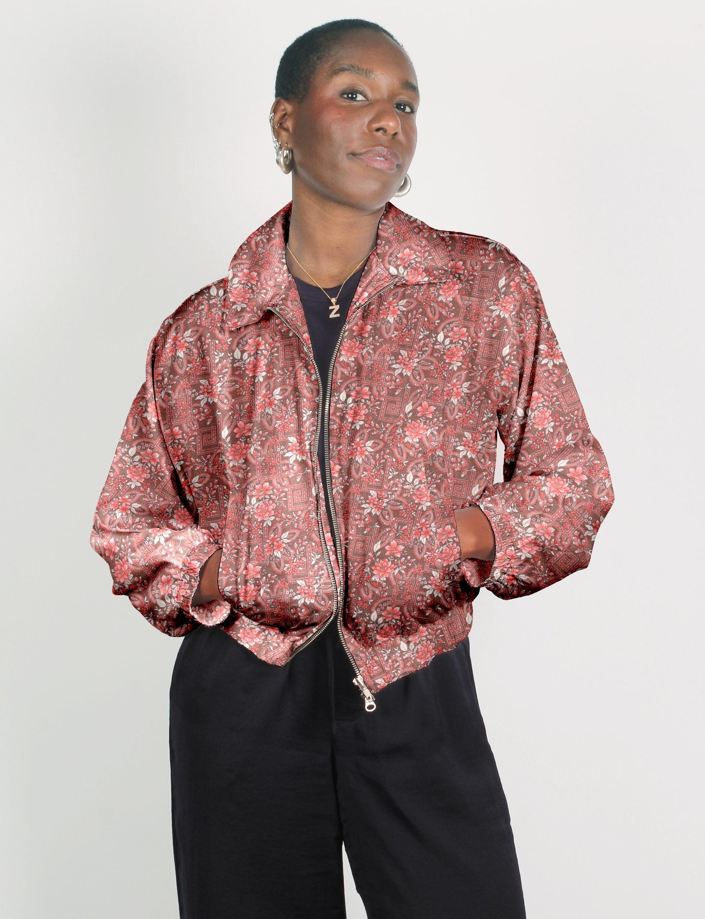 Stylish BOMBER JACKET, an upcycled clothing masterpiece with a cute cropped shape, elasticated details, and detachable metallic zipper. Contrast sari print lining adds a unique touch. Explore sustainable and eco-friendly fashion.