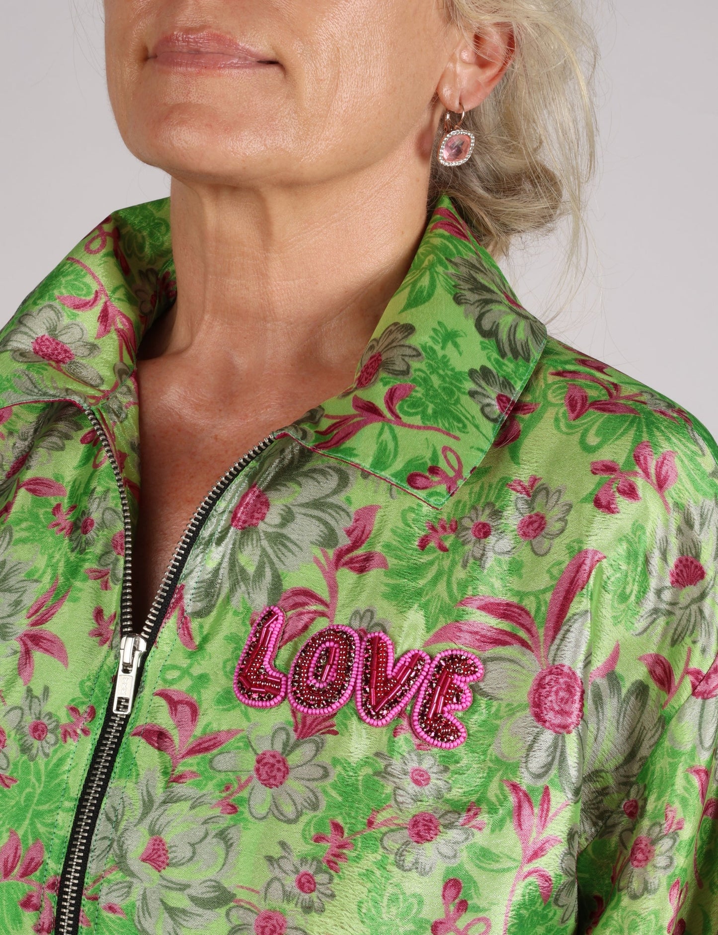 Love Bomber Jacket made from recycled fabric, featuring hand-stitched Aari embroidery. A unique piece of zero-waste clothing, part of the circular fashion movement. Designed with upcycled materials for a stylish yet environmentally friendly clothing choice.