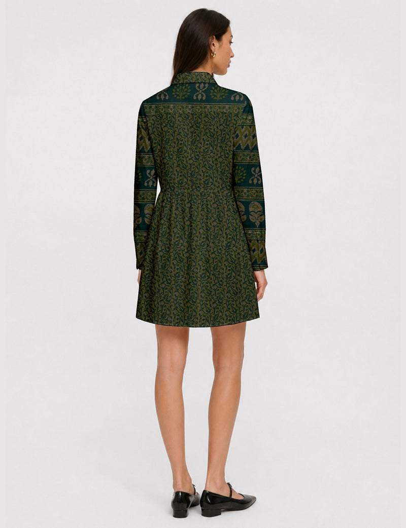 Short shirt dress with a relaxed A-line silhouette, point collar, partial button placket, gathered waist, side pockets, and full-length cuffed sleeves.