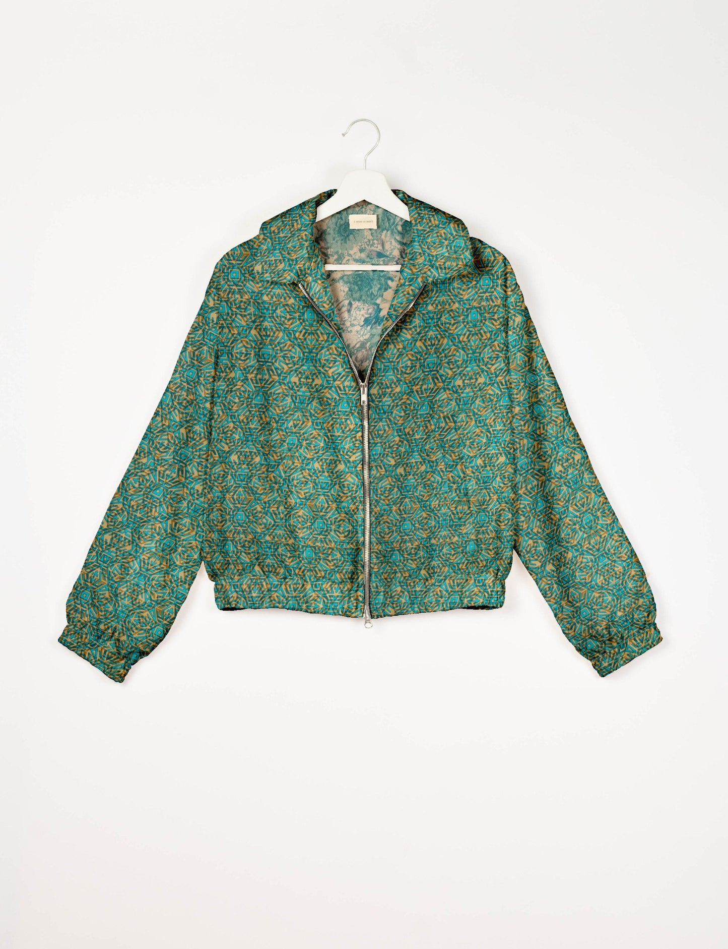 Upcycled Bomber Jacket made from recycled sari materials, featuring a cute cropped shape, elasticated hem and cuffs, and contrast sari print lining. Sustainable apparel promoting eco-friendly fashion and ethical clothing.