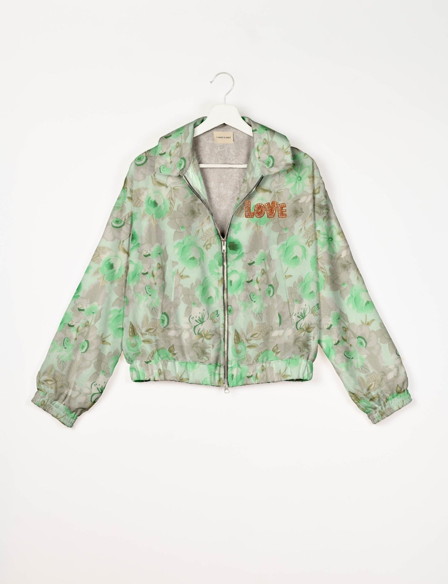 Love Bomber Jacket made from recycled fabric, featuring hand-stitched Aari embroidery. A unique piece of zero-waste clothing, part of the circular fashion movement. Designed with upcycled materials for a stylish yet environmentally friendly clothing choice.