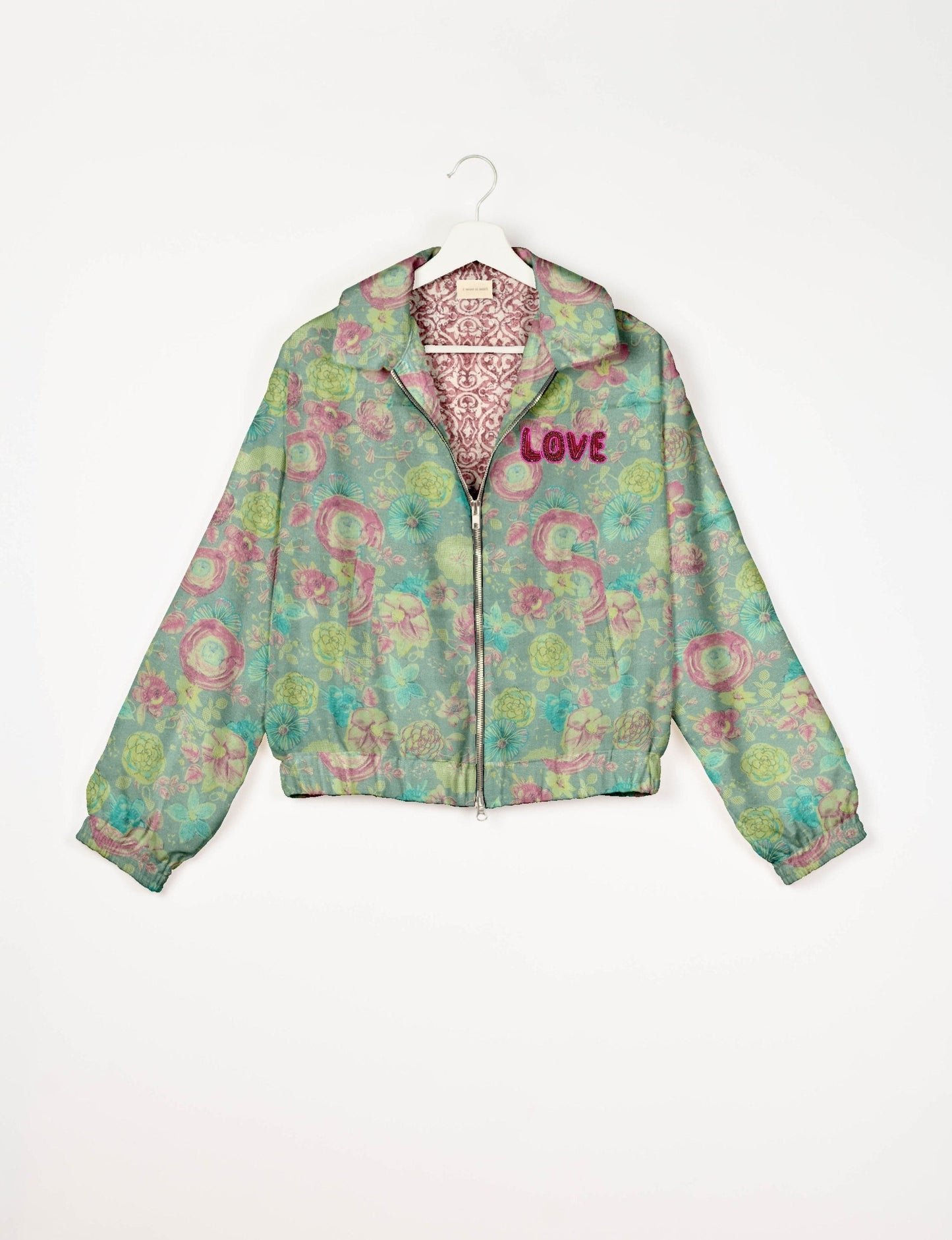 Love Bomber Jacket made from recycled fabric, featuring hand-stitched Aari embroidery. A unique piece of zero-waste clothing, part of the circular fashion movement. Designed with upcycled materials for a stylish yet environmentally friendly clothing choice.