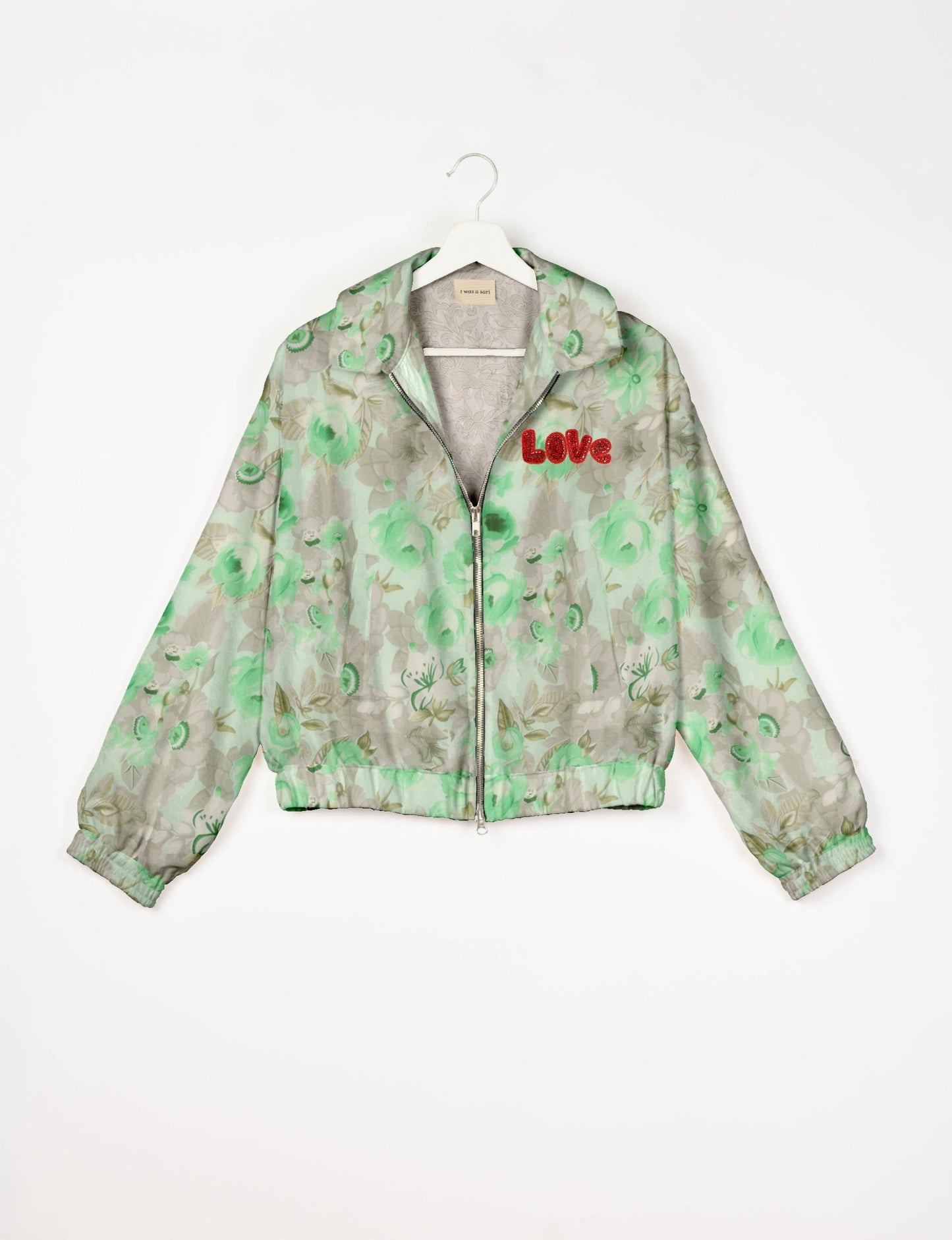 Love Bomber Jacket made from recycled fabric, featuring hand-stitched Aari embroidery. A unique piece of zero-waste clothing, part of the circular fashion movement. Designed with upcycled materials for a stylish yet environmentally friendly clothing choice.