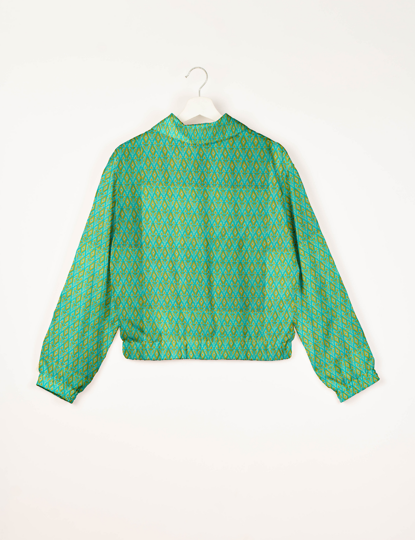 Upcycled Bomber Jacket made from recycled sari materials, featuring a cute cropped shape, elasticated hem and cuffs, and contrast sari print lining. Sustainable apparel promoting eco-friendly fashion and ethical clothing.