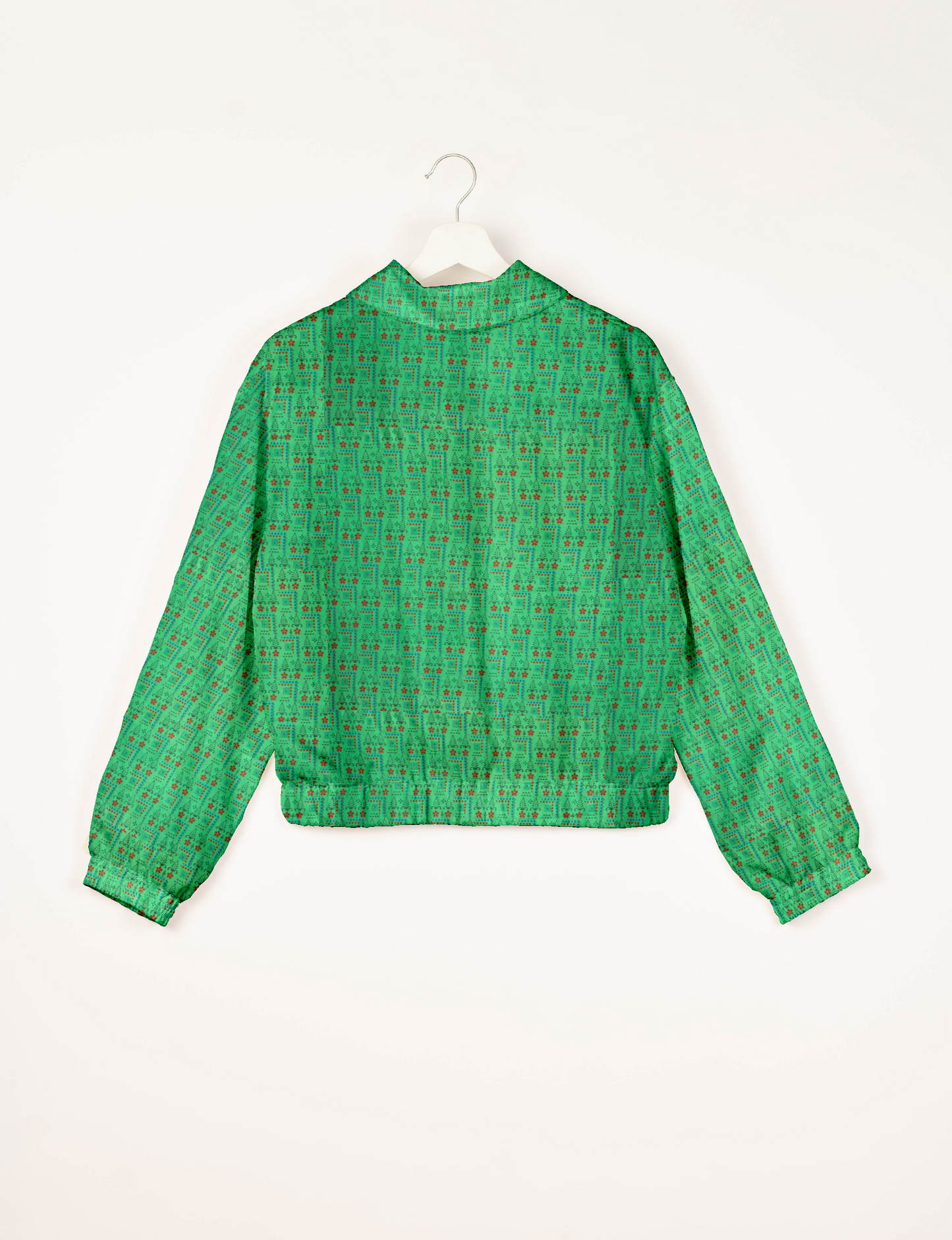 Upcycled Bomber Jacket made from recycled sari materials, featuring a cute cropped shape, elasticated hem and cuffs, and contrast sari print lining. Sustainable apparel promoting eco-friendly fashion and ethical clothing.