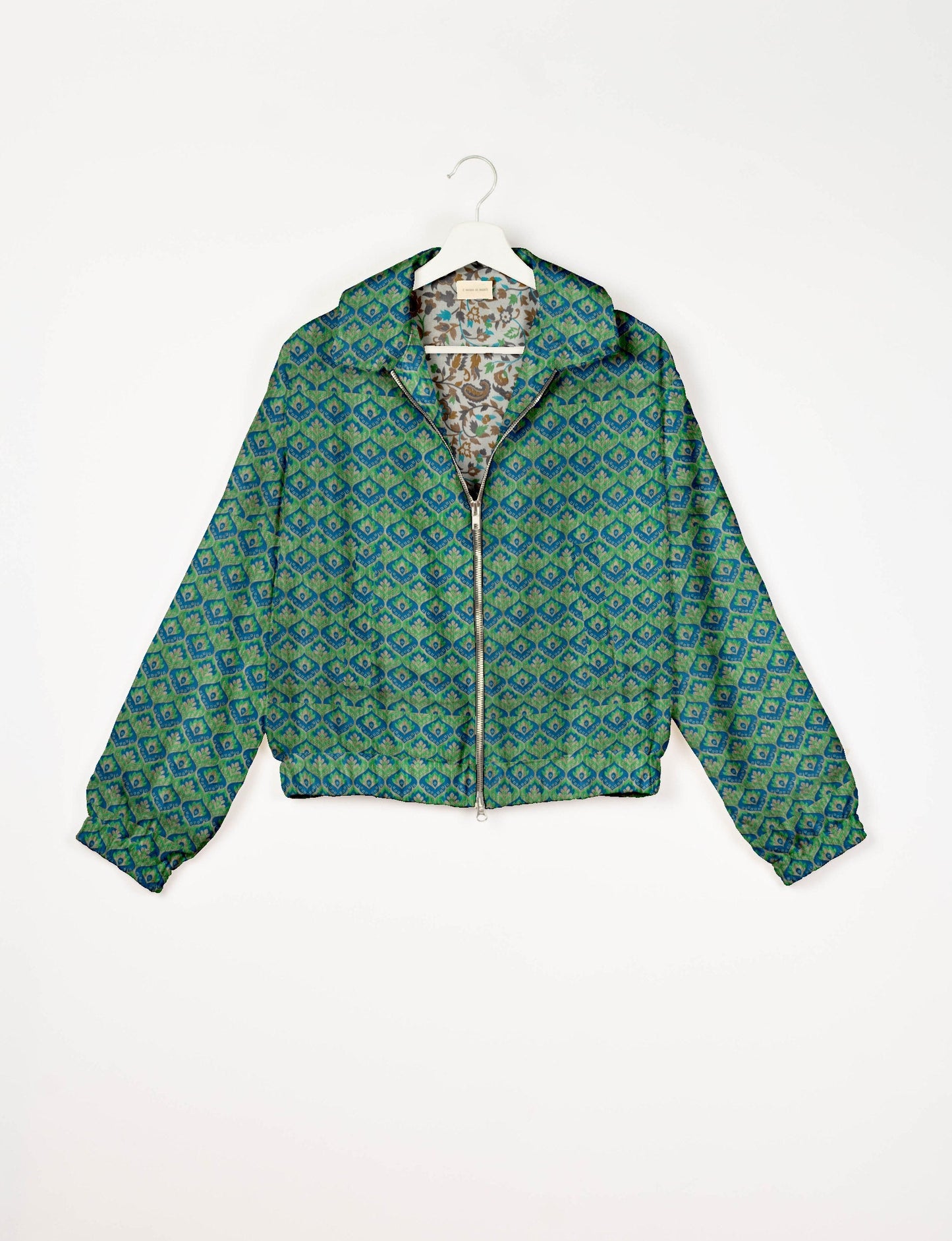 Upcycled Bomber Jacket made from recycled sari materials, featuring a cute cropped shape, elasticated hem and cuffs, and contrast sari print lining. Sustainable apparel promoting eco-friendly fashion and ethical clothing.