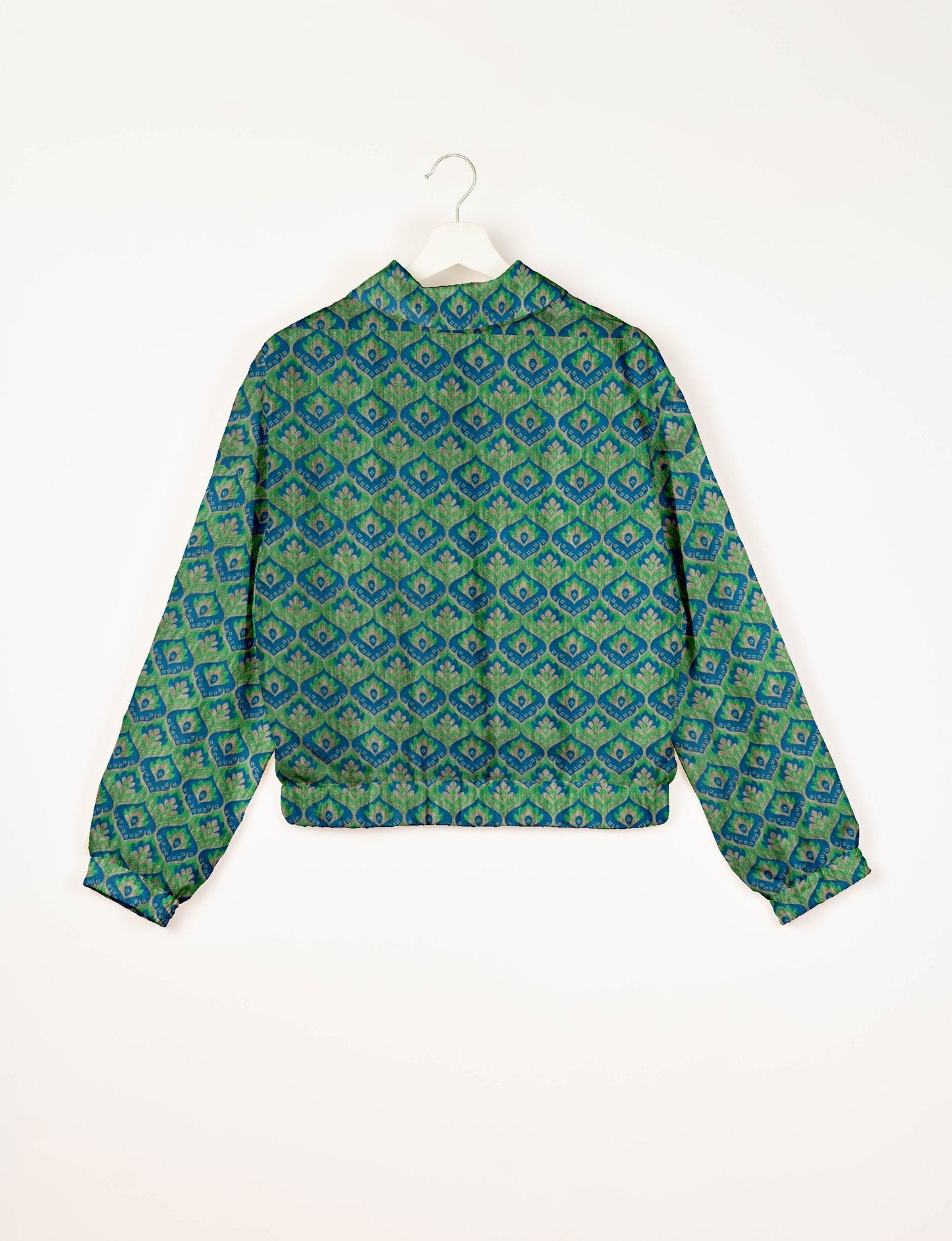 Upcycled Bomber Jacket made from recycled sari materials, featuring a cute cropped shape, elasticated hem and cuffs, and contrast sari print lining. Sustainable apparel promoting eco-friendly fashion and ethical clothing.