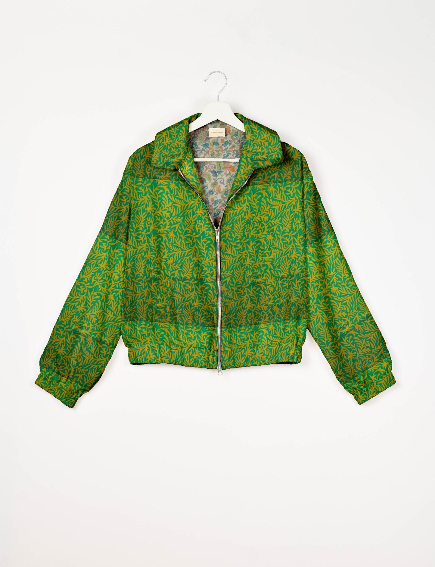 Upcycled Bomber Jacket made from recycled sari materials, featuring a cute cropped shape, elasticated hem and cuffs, and contrast sari print lining. Sustainable apparel promoting eco-friendly fashion and ethical clothing.
