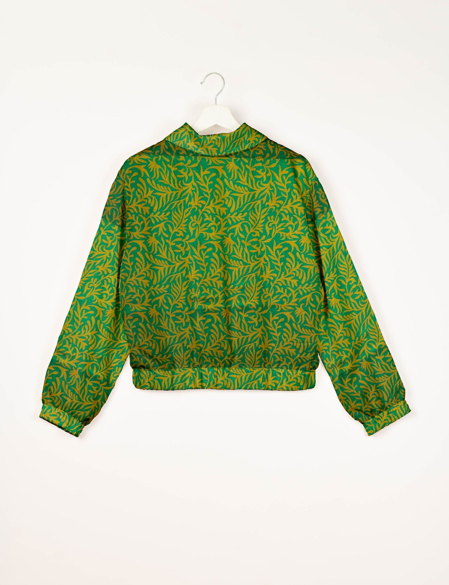 Upcycled Bomber Jacket made from recycled sari materials, featuring a cute cropped shape, elasticated hem and cuffs, and contrast sari print lining. Sustainable apparel promoting eco-friendly fashion and ethical clothing.