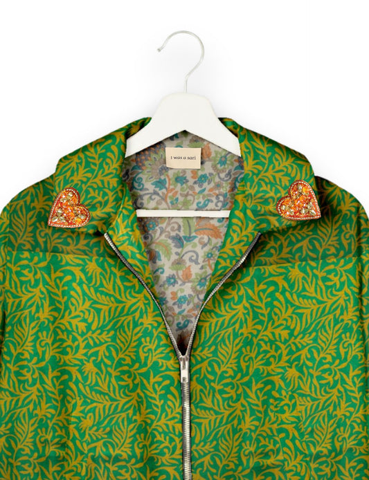 Make a bold statement with our Heart Drop Earrings, a symbol of conscious luxury and ethical fashion. Handcrafted using the intricate Aari embroidery technique, these earrings are made from upcycled sari fabric, embracing slow fashion and zero waste clothing. Elevate your look with sustainable apparel that supports fair trade fashion while reducing textile waste. Choose eco-friendly fashion that speaks of love, artistry, and responsibility.