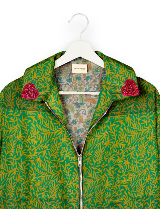 Make a bold statement with our Heart Drop Earrings, a symbol of conscious luxury and ethical fashion. Handcrafted using the intricate Aari embroidery technique, these earrings are made from upcycled sari fabric, embracing slow fashion and zero waste clothing. Elevate your look with sustainable apparel that supports fair trade fashion while reducing textile waste. Choose eco-friendly fashion that speaks of love, artistry, and responsibility.