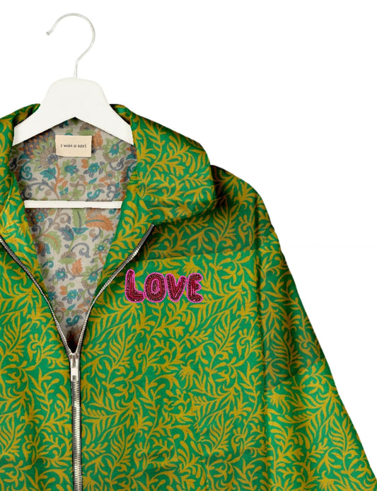 Love Bomber Jacket made from recycled fabric, featuring hand-stitched Aari embroidery. A unique piece of zero-waste clothing, part of the circular fashion movement. Designed with upcycled materials for a stylish yet environmentally friendly clothing choice.