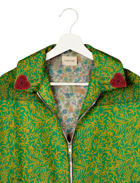 Make a bold statement with our Heart Drop Earrings, a symbol of conscious luxury and ethical fashion. Handcrafted using the intricate Aari embroidery technique, these earrings are made from upcycled sari fabric, embracing slow fashion and zero waste clothing. Elevate your look with sustainable apparel that supports fair trade fashion while reducing textile waste. Choose eco-friendly fashion that speaks of love, artistry, and responsibility.