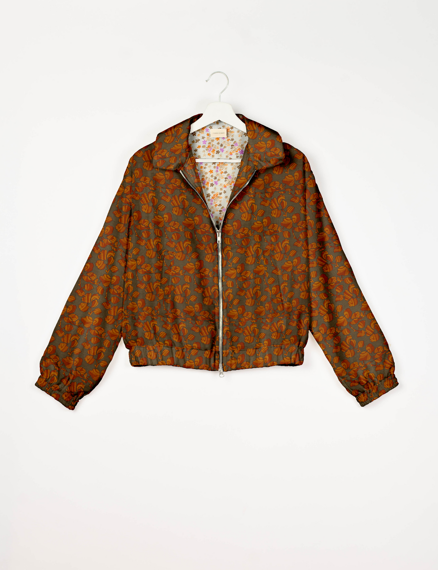 Upcycled Bomber Jacket made from recycled sari materials, featuring a cute cropped shape, elasticated hem and cuffs, and contrast sari print lining. Sustainable apparel promoting eco-friendly fashion and ethical clothing.