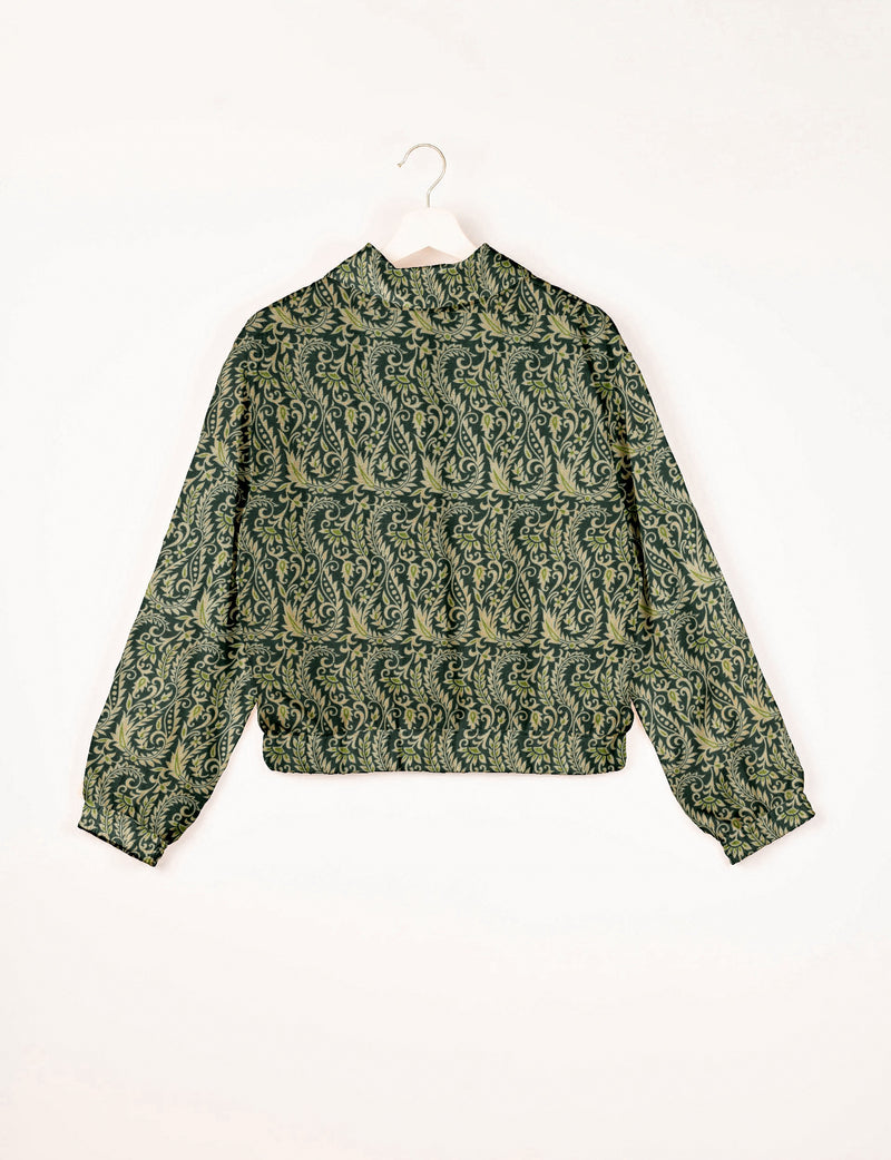 Green bomber jacket with intricate light green leaf and vine pattern, elastic cuffs and waistband, shown from back on hanger