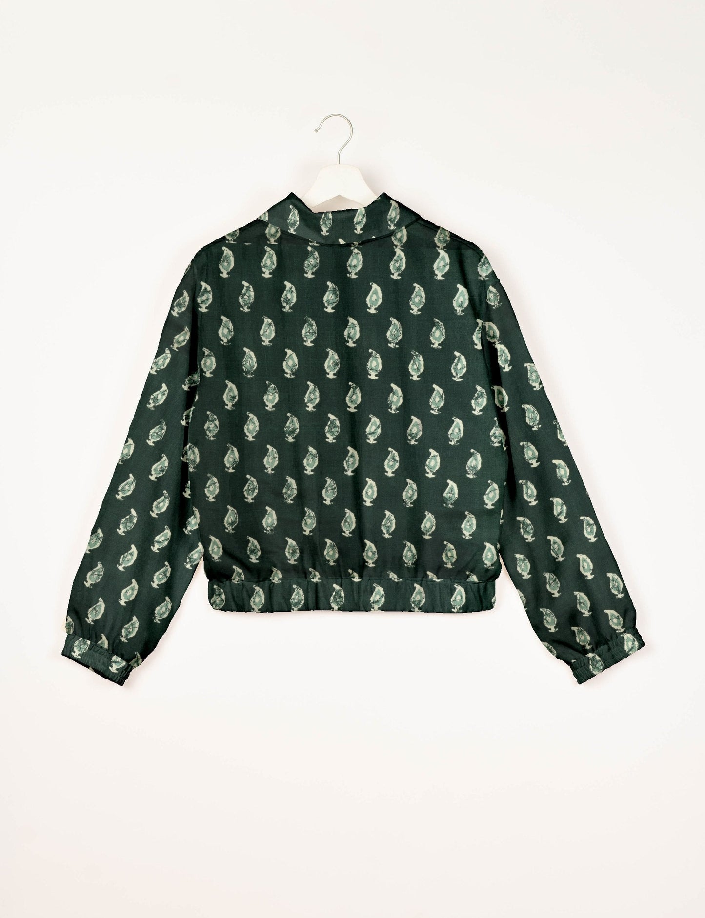 Upcycled Bomber Jacket made from recycled sari materials, featuring a cute cropped shape, elasticated hem and cuffs, and contrast sari print lining. Sustainable apparel promoting eco-friendly fashion and ethical clothing.