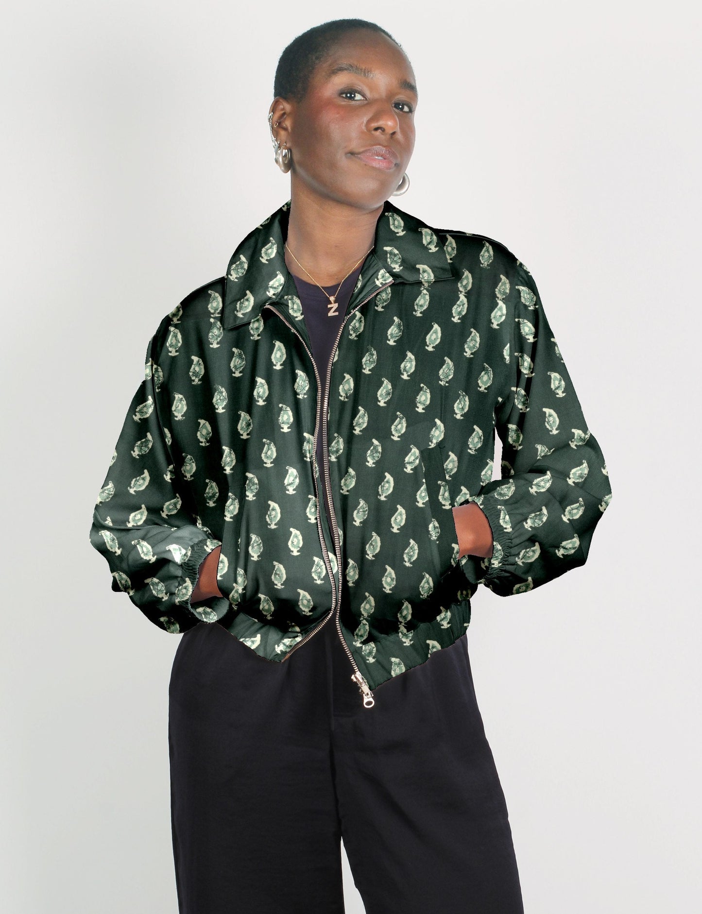 Upcycled Bomber Jacket made from recycled sari materials, featuring a cute cropped shape, elasticated hem and cuffs, and contrast sari print lining. Sustainable apparel promoting eco-friendly fashion and ethical clothing.