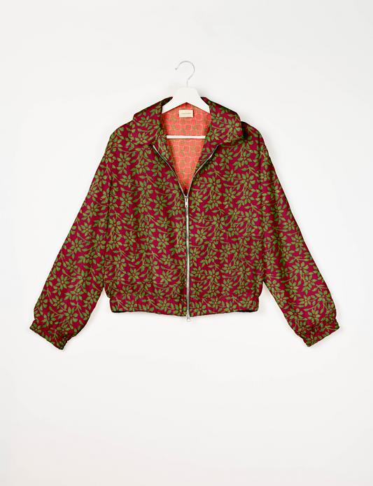 Stylish BOMBER JACKET, an upcycled clothing masterpiece with a cute cropped shape, elasticated details, and detachable metallic zipper. Contrast sari print lining adds a unique touch. Explore sustainable and eco-friendly fashion.