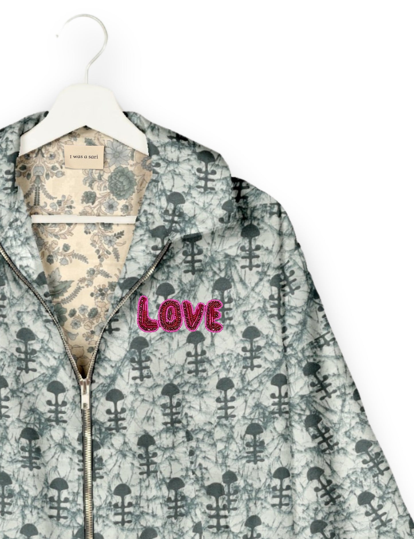 Love Bomber Jacket made from recycled fabric, featuring hand-stitched Aari embroidery. A unique piece of zero-waste clothing, part of the circular fashion movement. Designed with upcycled materials for a stylish yet environmentally friendly clothing choice.