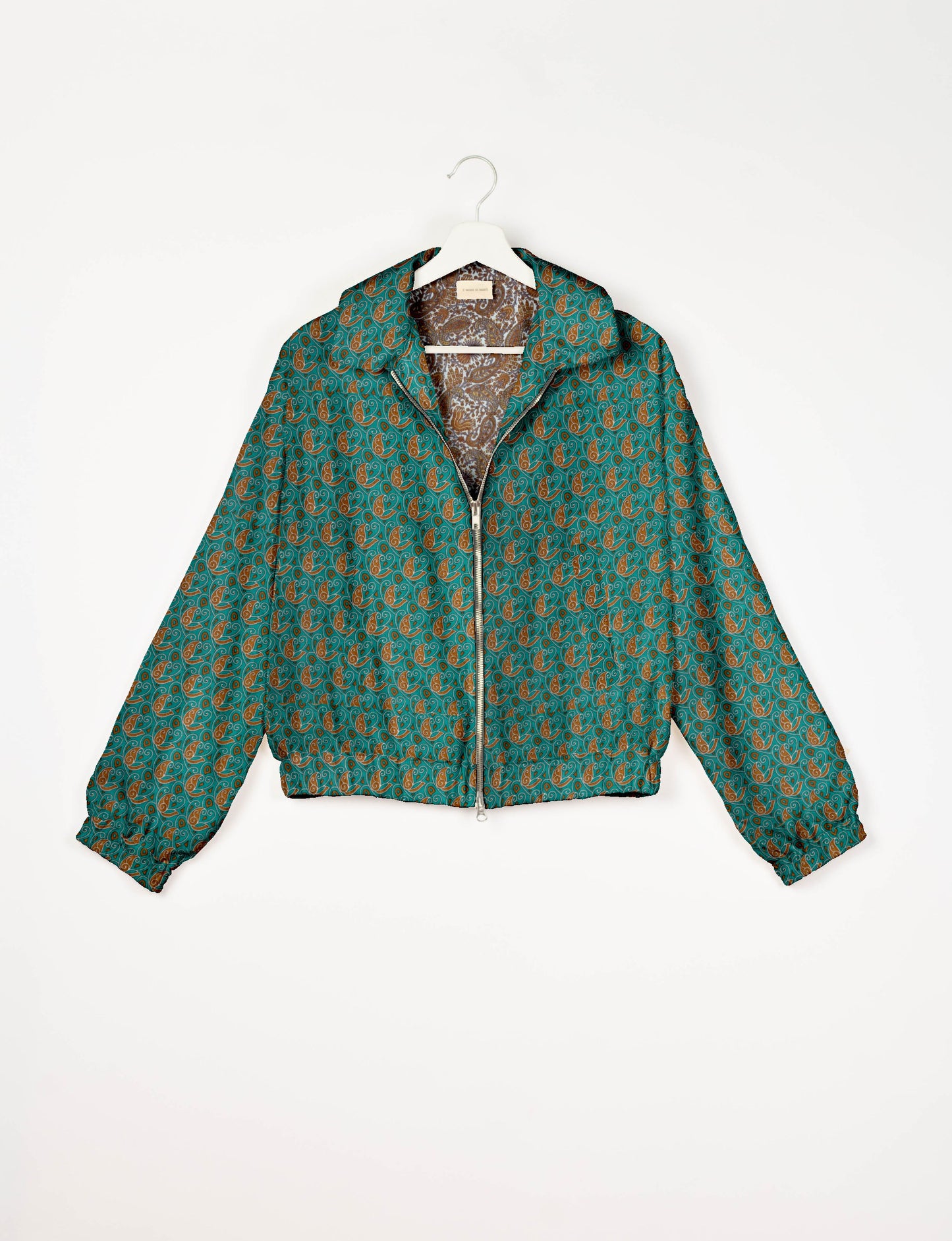 Upcycled Bomber Jacket made from recycled sari materials, featuring a cute cropped shape, elasticated hem and cuffs, and contrast sari print lining. Sustainable apparel promoting eco-friendly fashion and ethical clothing.