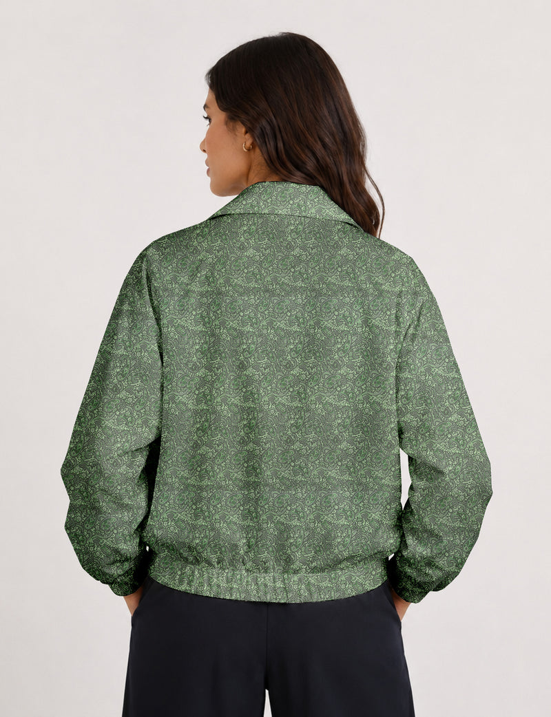 Brown floral bomber jacket with front zipper, elastic cuffs and hem, hanging on white hanger, red floral inner lining visible