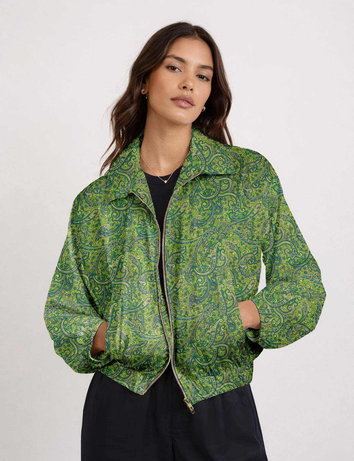 Woman wearing a yellow floral bomber jacket with front zipper, elastic cuffs, and side pockets, shown from front view