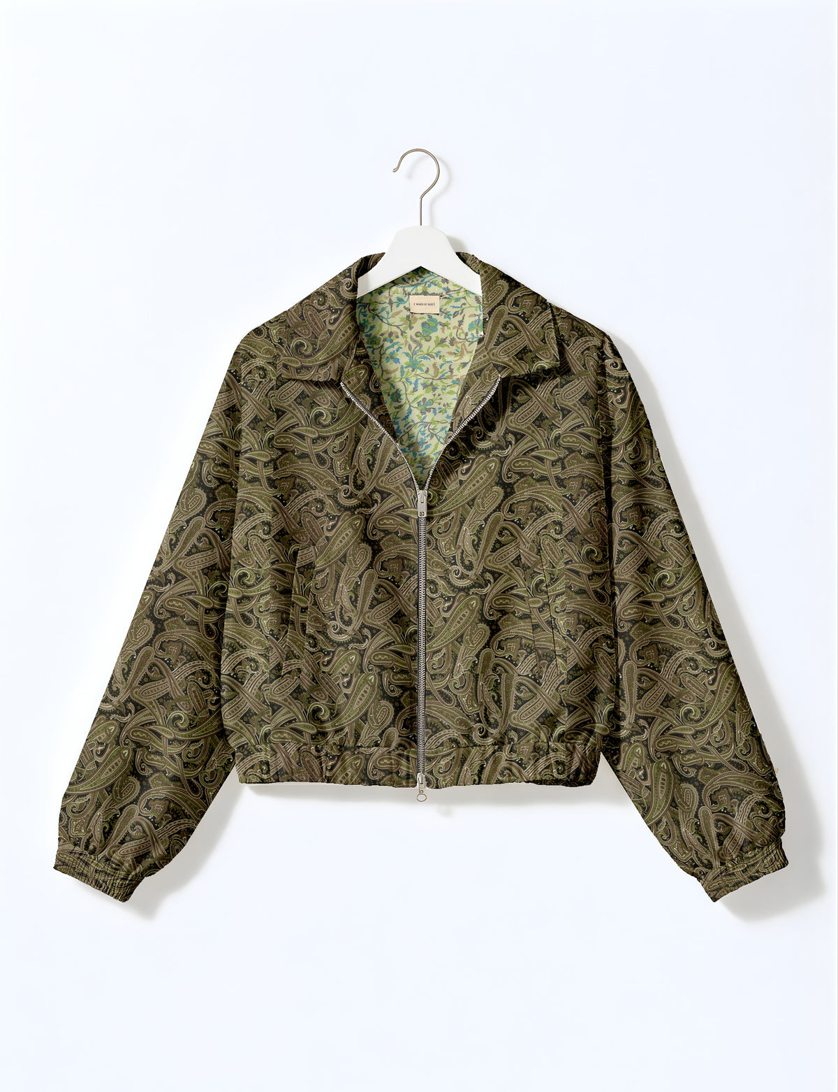 Woman wearing a yellow floral bomber jacket with front zipper, elastic cuffs, and side pockets, shown from front view