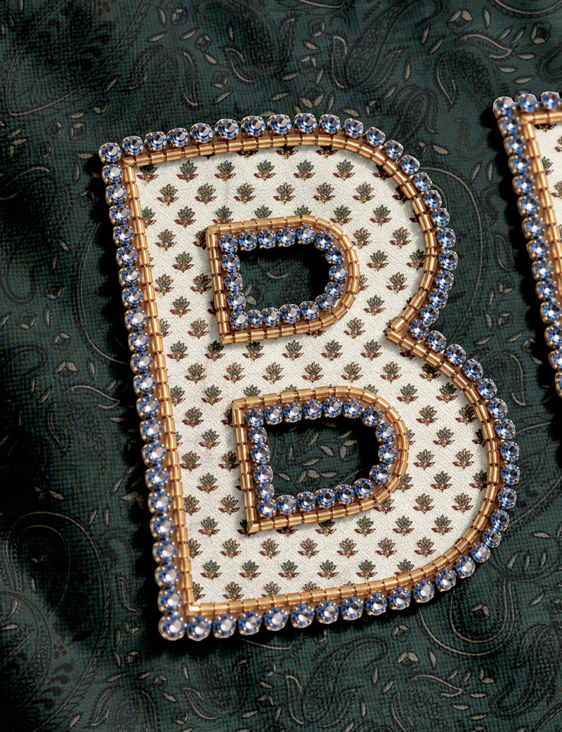 Be Kind tote bag with contrast sari fabric appliqué lettering, double shoulder straps, and front slip pocket.