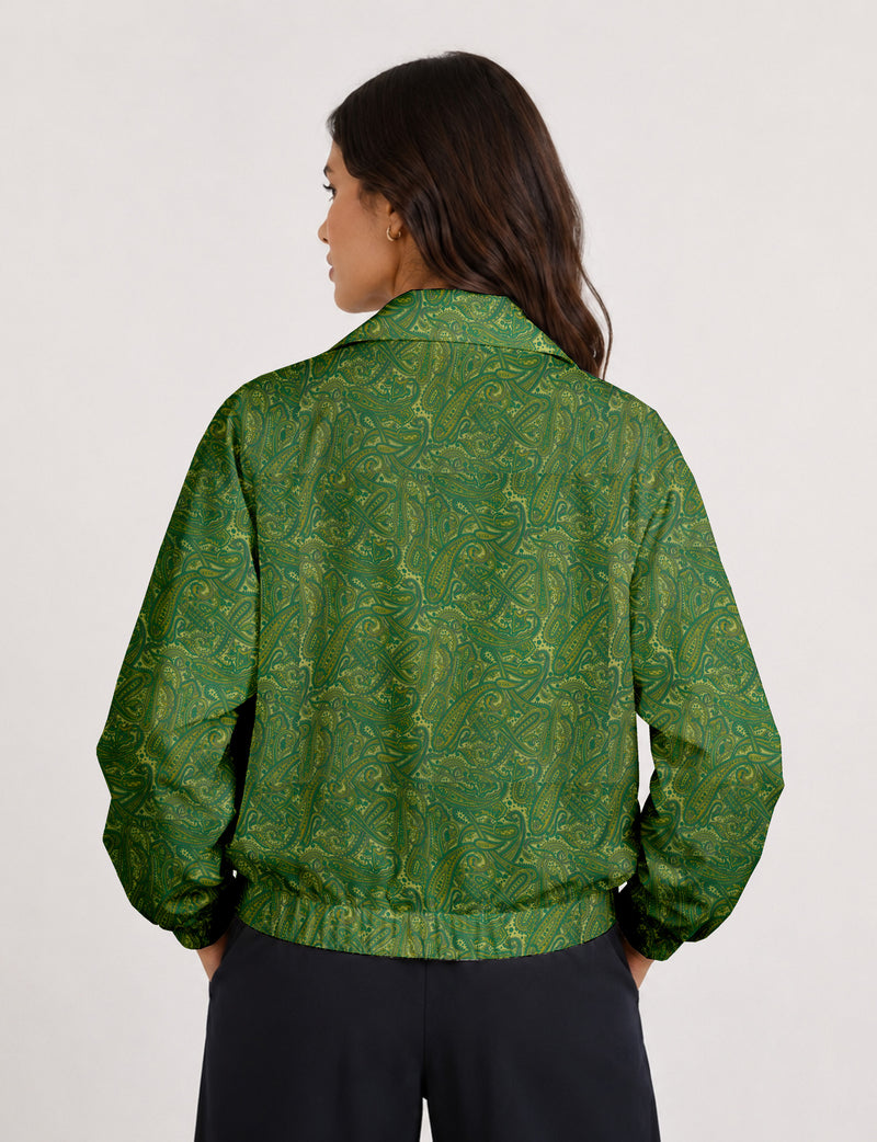 Woman wearing a yellow floral bomber jacket with front zipper, elastic cuffs, and side pockets, shown from front view