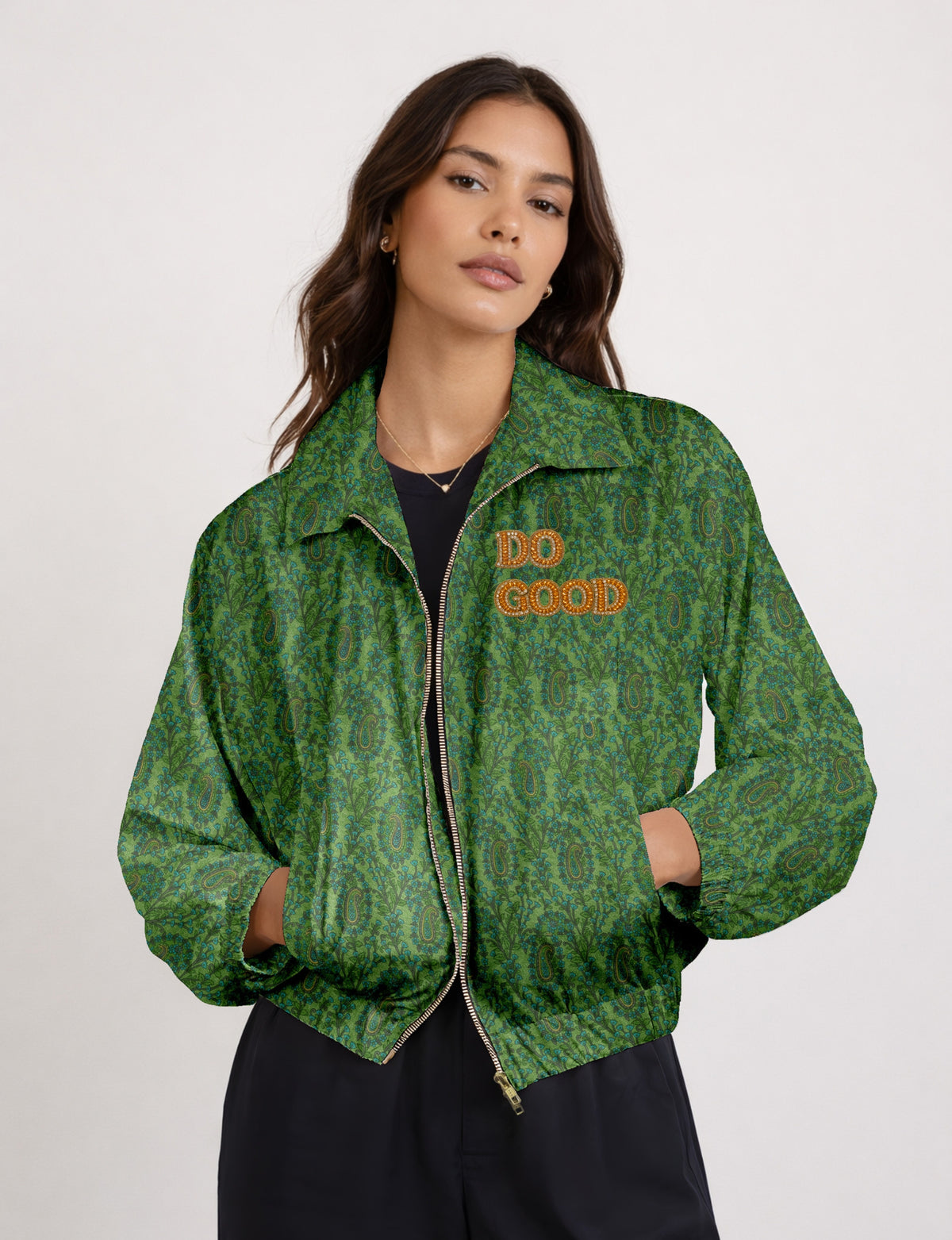 Gold cropped DO GOOD bomber jacket featuring hand-embroidered lettering on the left chest, contrasting inner lining and two functional pockets.