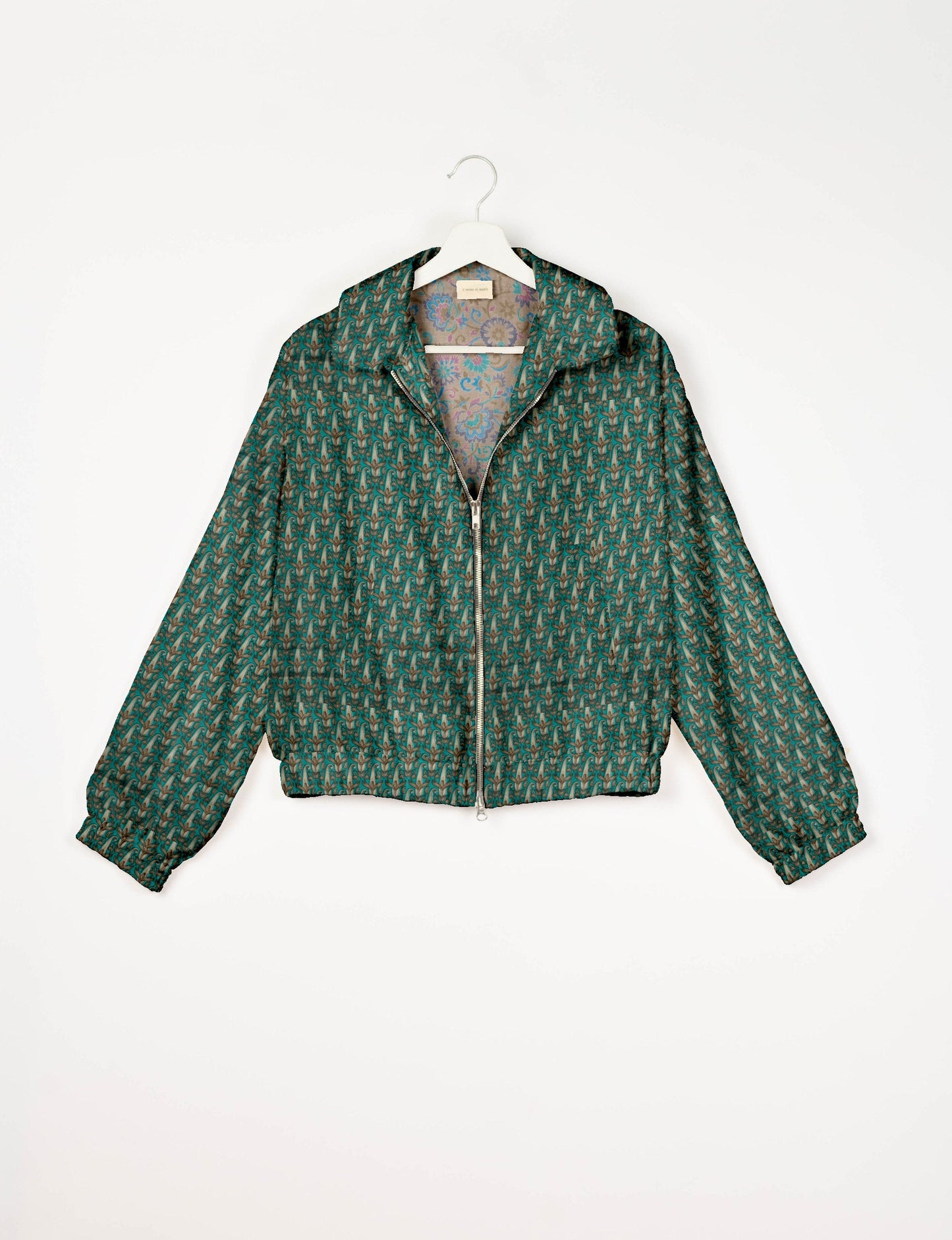 Upcycled Bomber Jacket made from recycled sari materials, featuring a cute cropped shape, elasticated hem and cuffs, and contrast sari print lining. Sustainable apparel promoting eco-friendly fashion and ethical clothing.