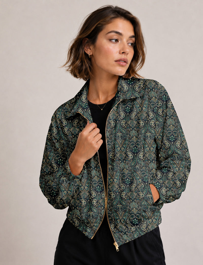 Brown floral bomber jacket with front zipper, elastic cuffs and hem, hanging on white hanger, red floral inner lining visible