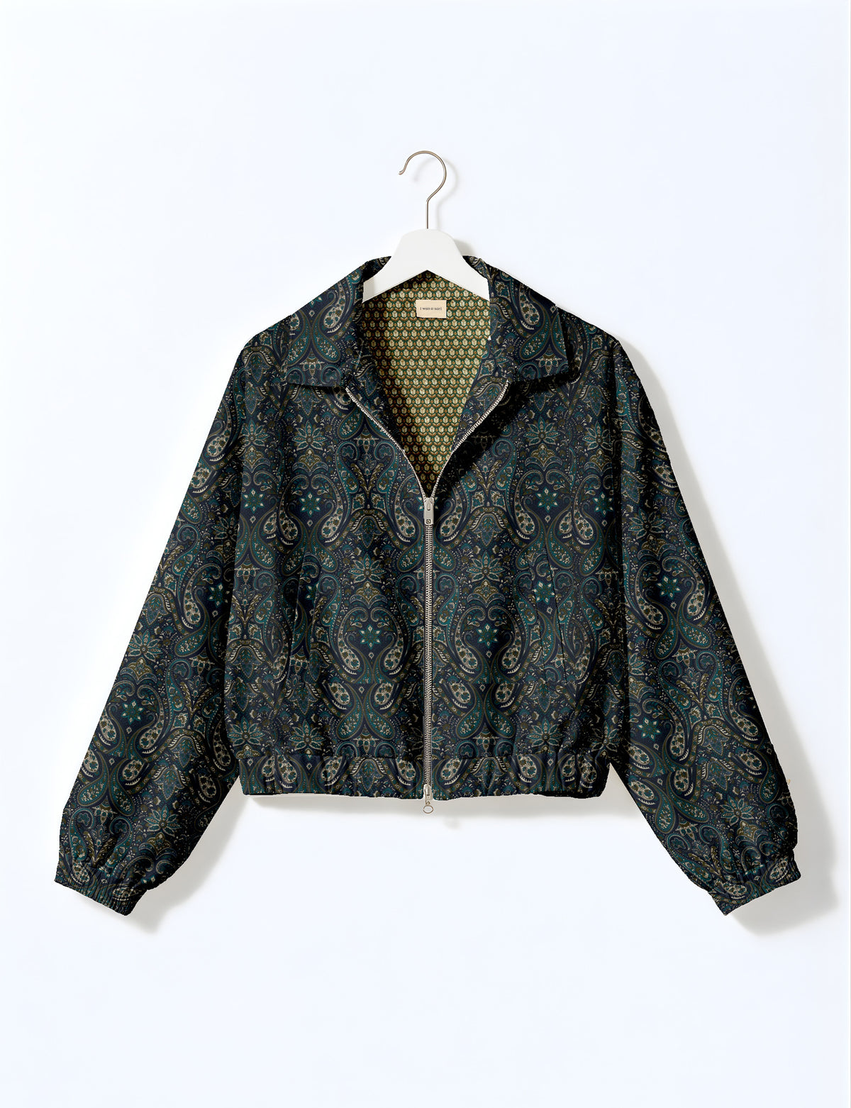Brown floral bomber jacket with front zipper, elastic cuffs and hem, hanging on white hanger, red floral inner lining visible